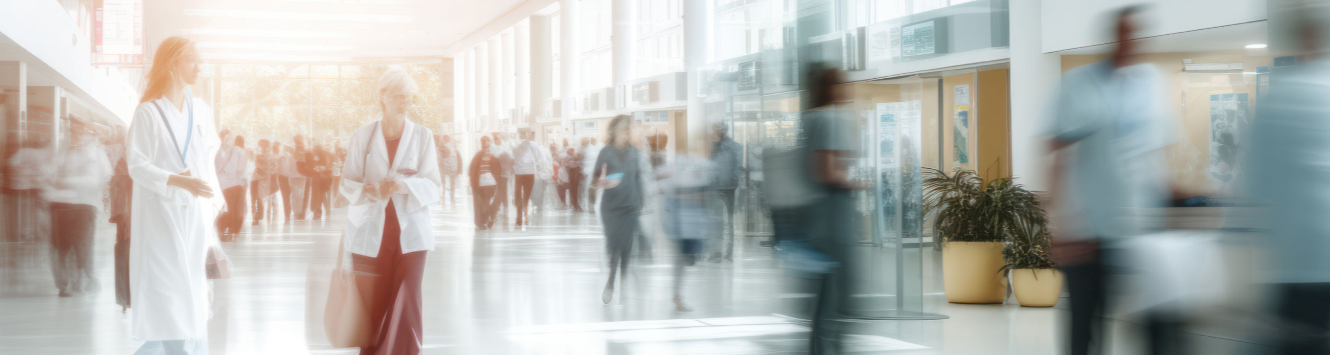 aAbstract motion blur image of people walking through a hospital building