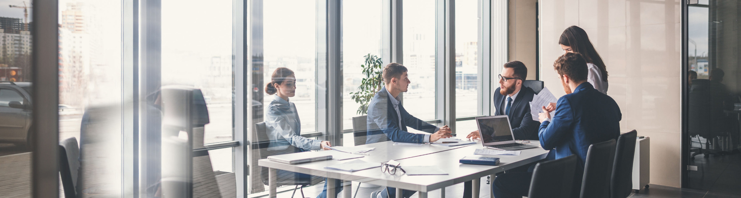 People sitting around a table in a business meeting